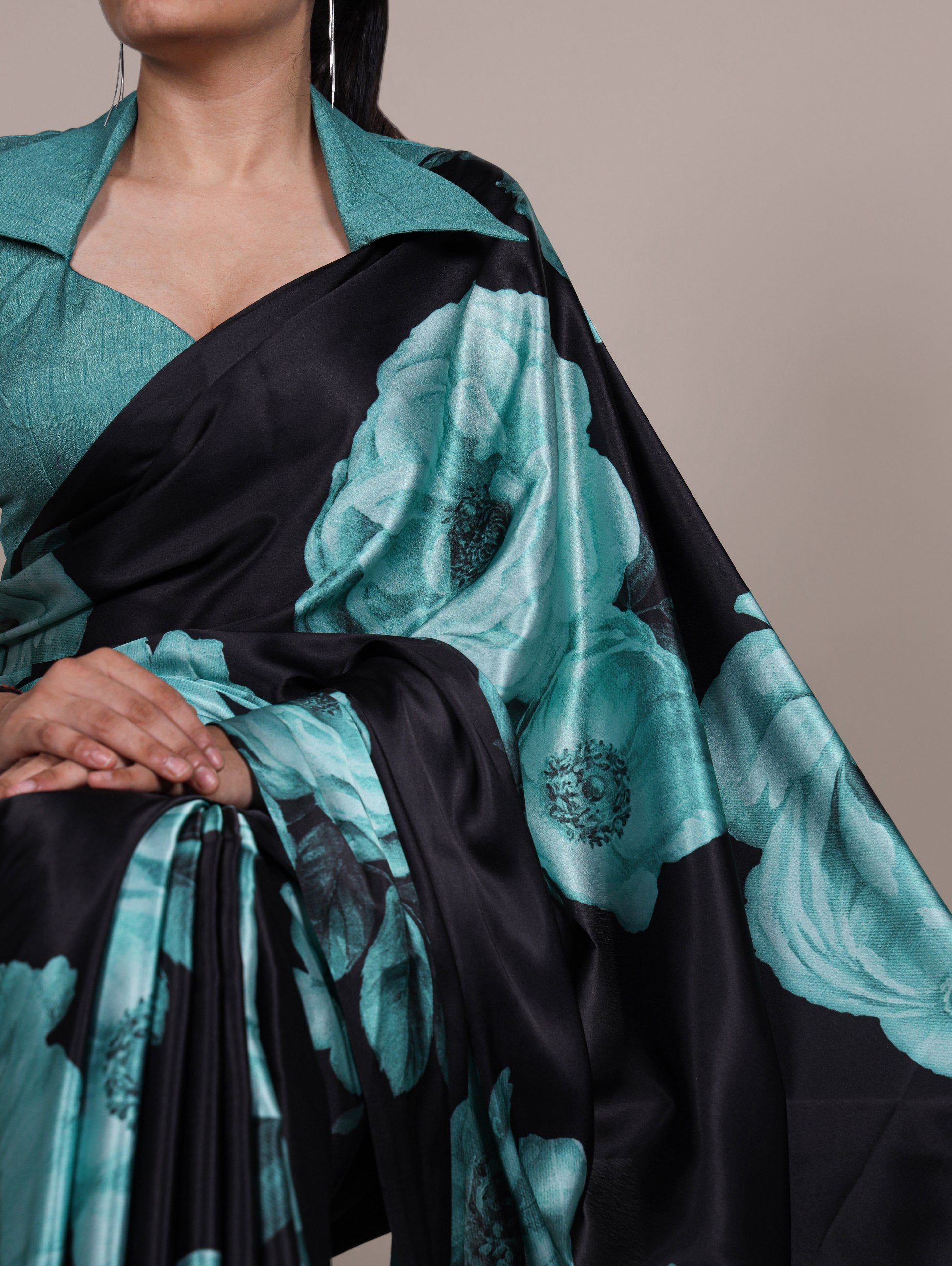 A saree that blends floral charm with satin smoothness