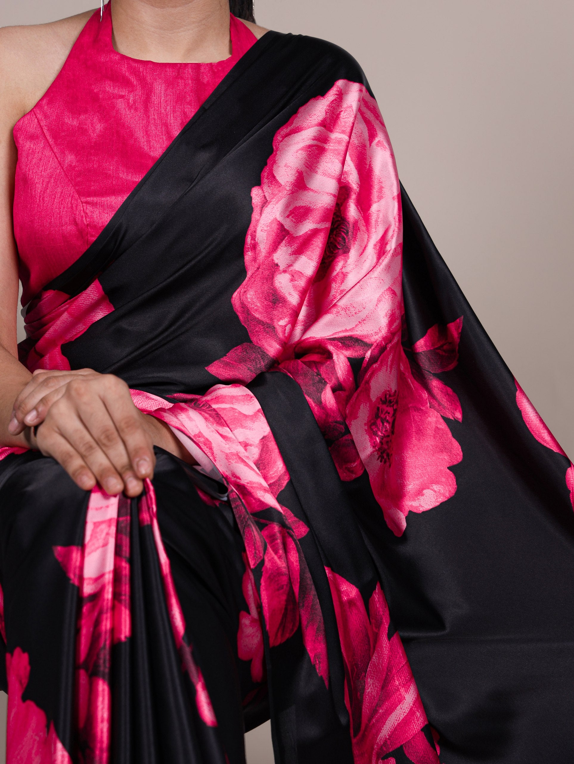 A saree that blends floral charm with satin smoothness
